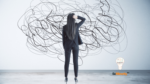Woman in tech confidently presenting ideas, symbolizing overcoming imposter syndrome and thriving in leadership